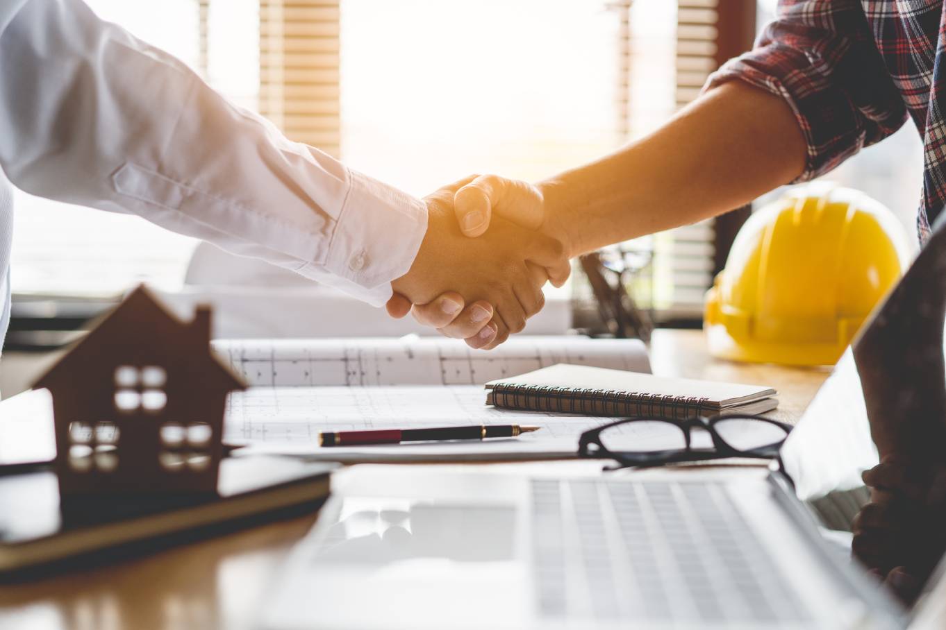 A trusting homeowner who just agreed to hire a contractor for their home improvement projects.