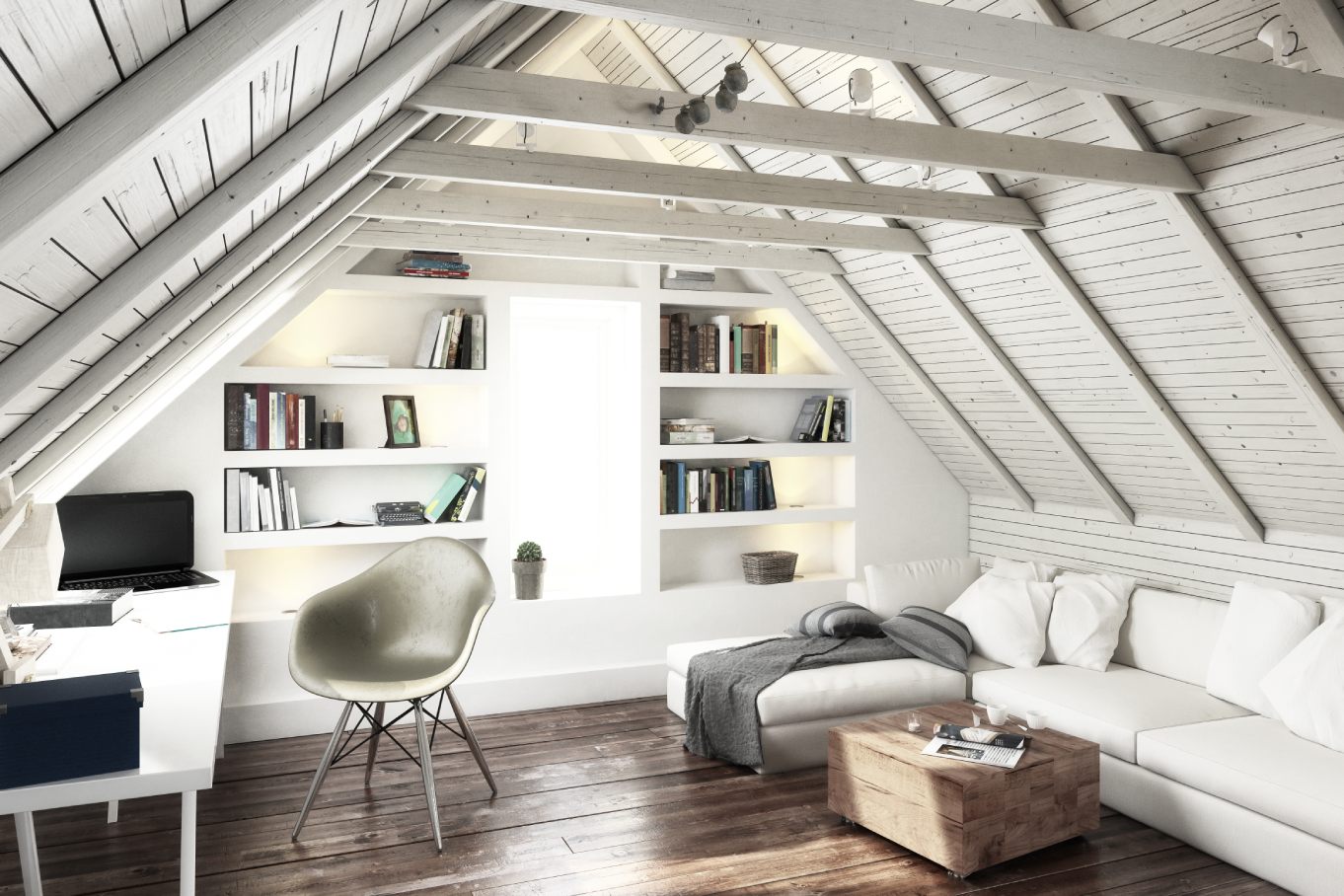 A freshly renovated attic space with white features, a comfortable couch on the right, and a work desk on the left side.